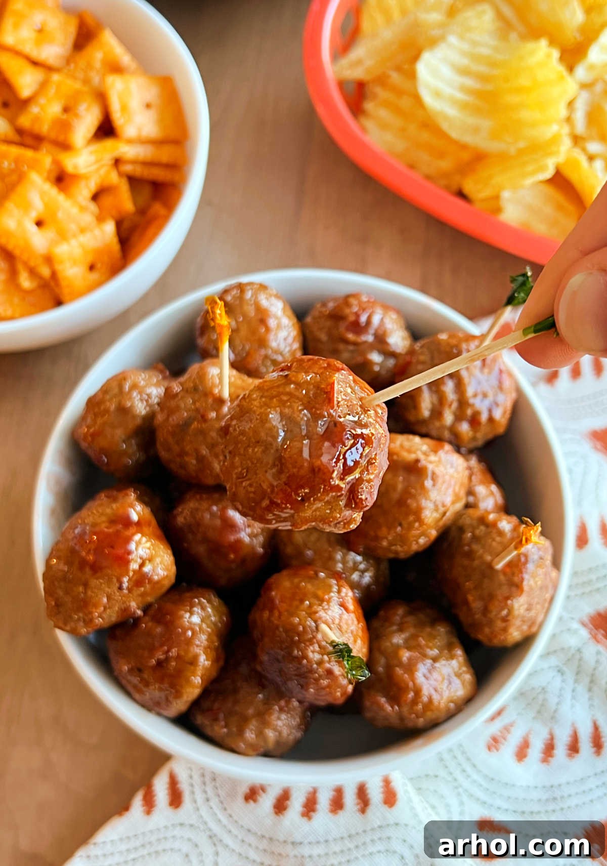 meatball with grape jelly and chili sauce on toothpick.