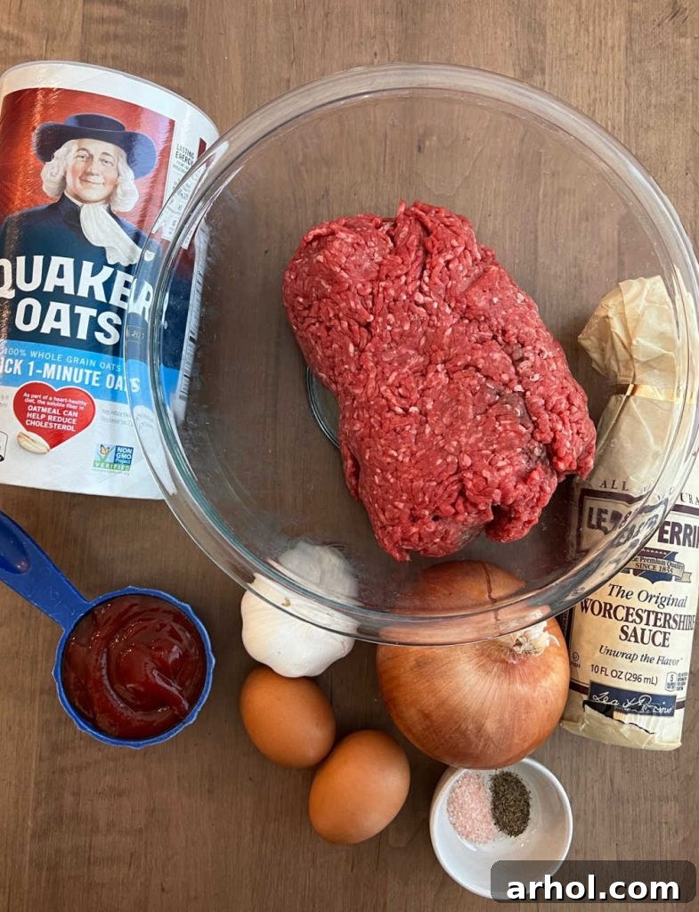 Key ingredients for Quaker Oats meatloaf laid out: ground beef, quick oats, ketchup, eggs, garlic, onion, and various seasonings.