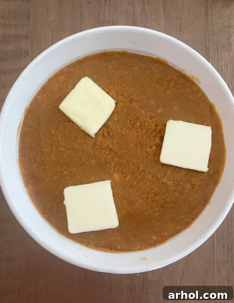pats of butter on mashed sweet potatoes.