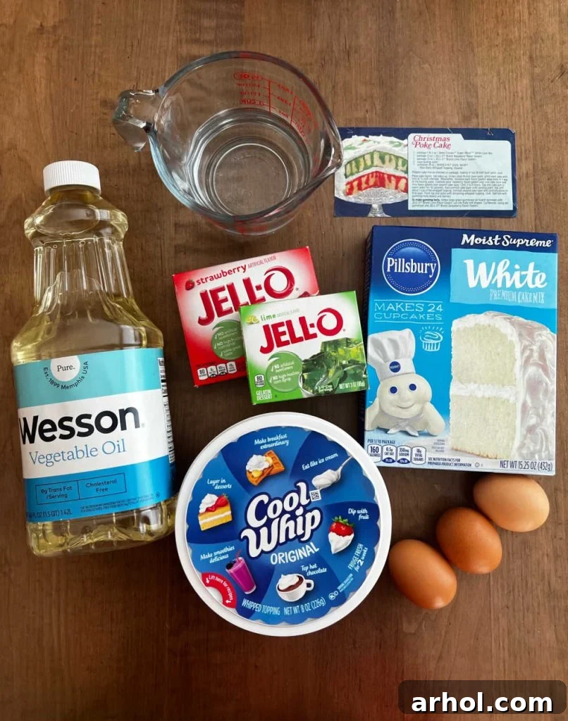 Ingredients for Christmas Jello Poke Cake: cake mix, water, oil, Jell-O packets, cool whip, and eggs.