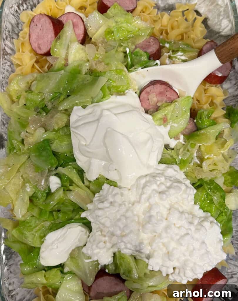 Casserole ingredients being mixed together in a large baking dish before baking.