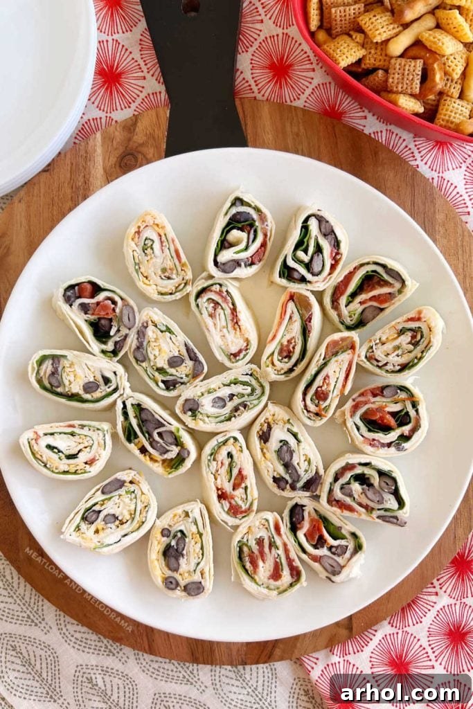 Festive Pinwheel Bites 2 platter of colorful tortilla pinwheels rollups arranged appealingly on a table