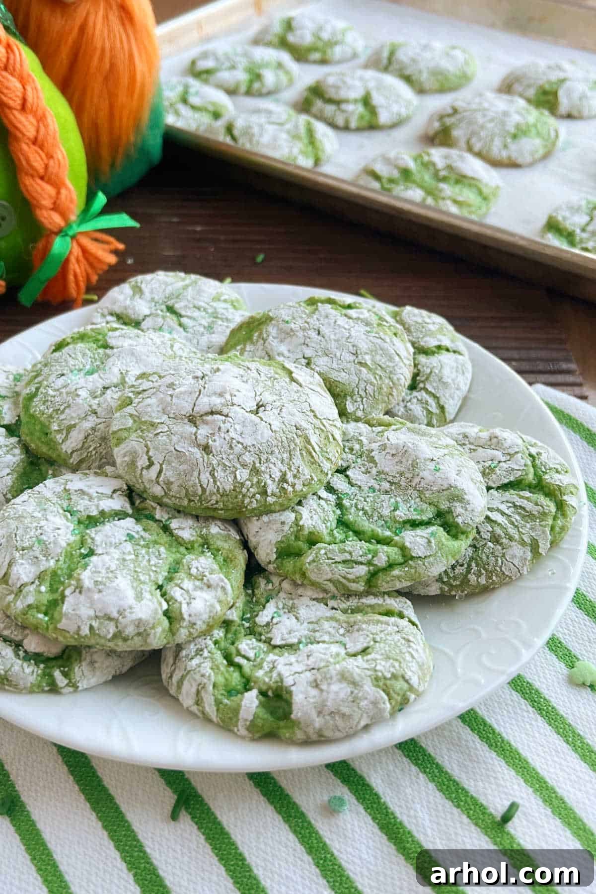Vibrant green St. Patrick's Day crinkle cookies arranged on a table, ready for celebration and sharing.