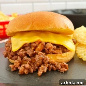 homemade sloppy joes sandwich on bun with American cheese.