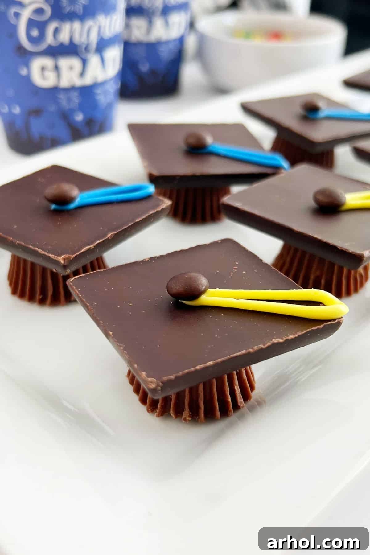 chocolate graduation caps treats on a platter at grad party.