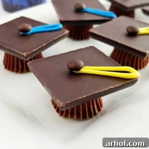 chocolate graduation caps treats made with Reese's candy on a platter.