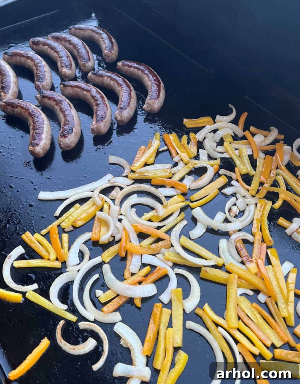 Perfectly cooked Italian sausage, tender peppers, and caramelized onions served hot from the flat top grill.