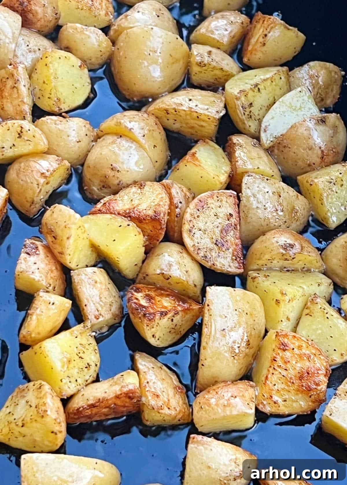 Sizzling Spuds The Blackstone Way 2 Crispy fried baby potatoes cooking on a Blackstone griddle, ready to be served as a delicious side dish.