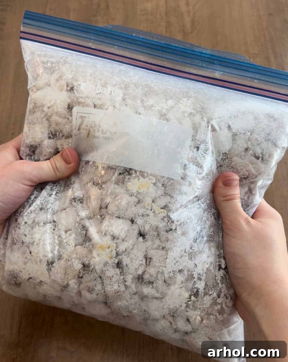 Star-Spangled Snack Mix 6 Shaking Muddy Buddies in a large freezer bag to evenly coat the cereal with powdered sugar, a quick and mess-free method.