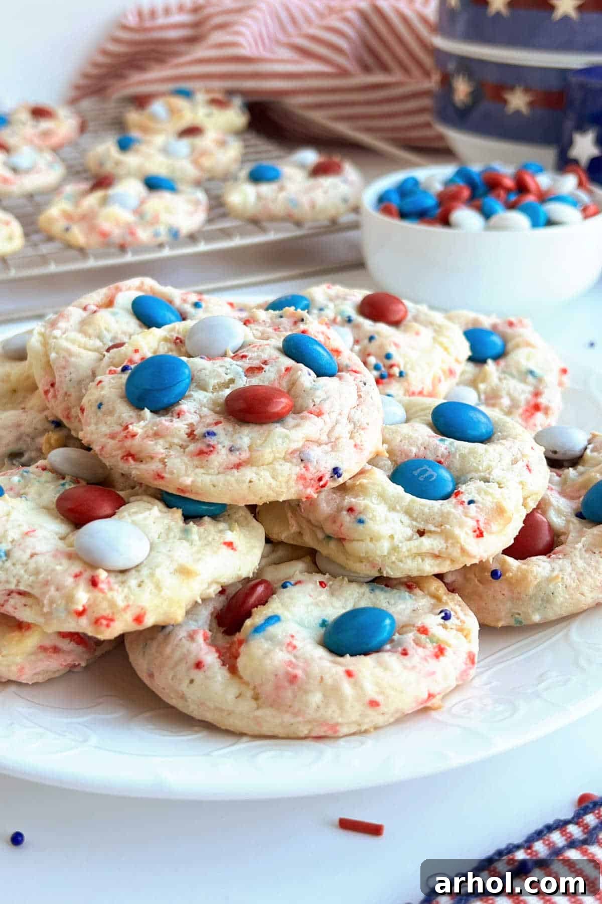 Delicious and easy patriotic 4th of July cookies, decorated with festive red, white, and blue sprinkles and M&M's, perfect for Independence Day celebrations.