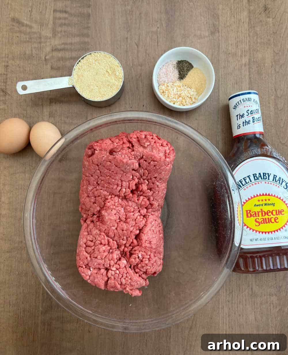 Smoky Barbecue Glazed Meatloaf 3 Ground meat, eggs, cracker crumbs, seasonings, and BBQ sauce laid out for making smoked meatloaf.