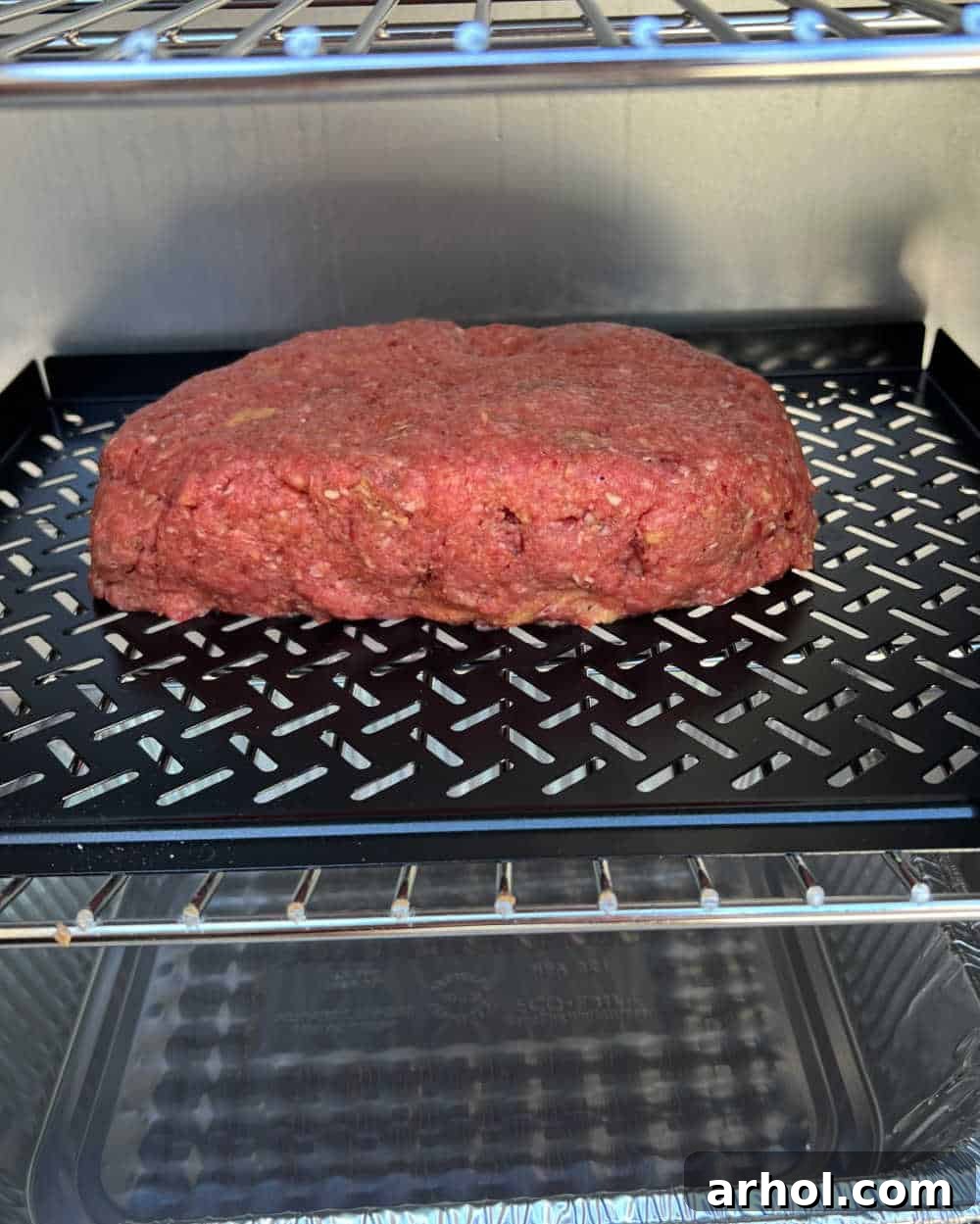 Smoky Barbecue Glazed Meatloaf 5 Meatloaf cooking inside an electric smoker, absorbing smoky flavor.