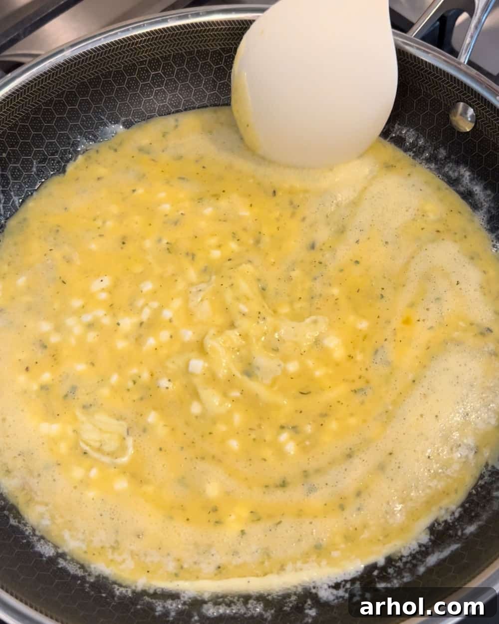High Protein Cottage Cheese Egg Scramble 6 Gently stirring scrambled eggs in a skillet as they cook.