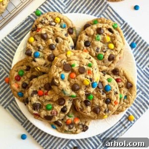Monster cookies stacked on a plate, ready to be served.