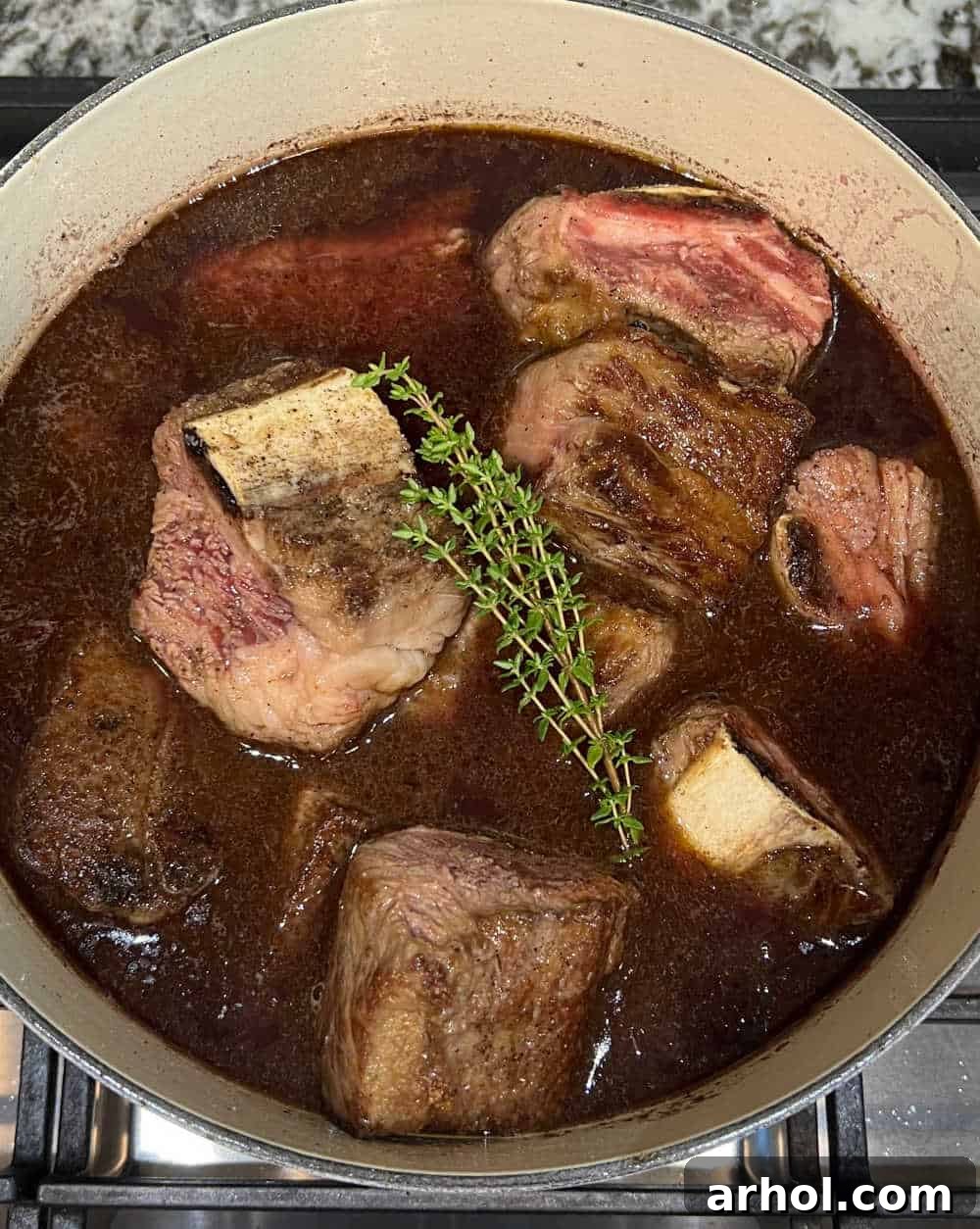 Melt-In-Your-Mouth Braised Short Ribs 6 seared beef ribs in braising liquid in dutch oven.