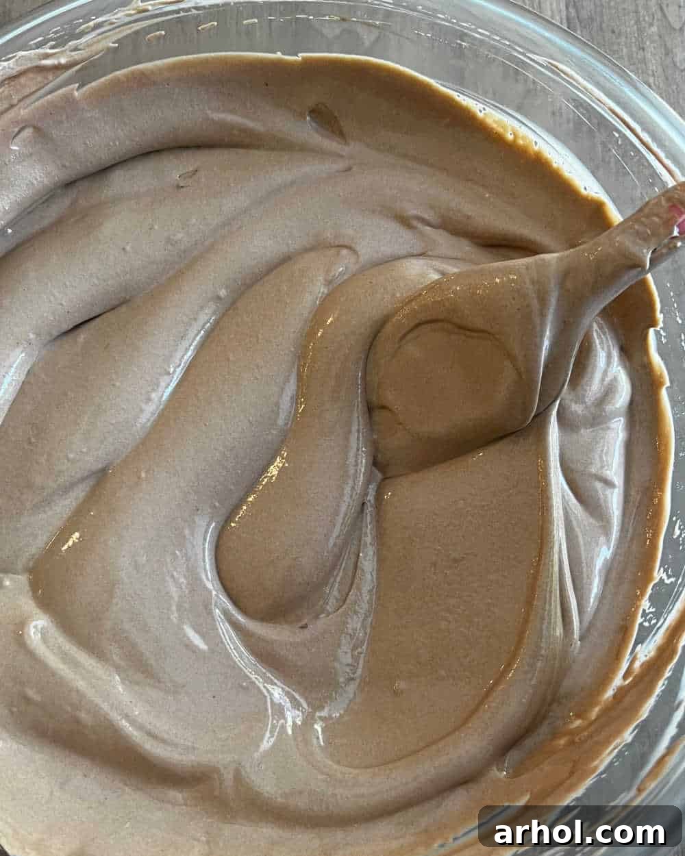 Quick Spooky Dirt Cups 4 Mixing chocolate pudding and cool whip with a rubber spatula until the mixture is creamy and fluffy.