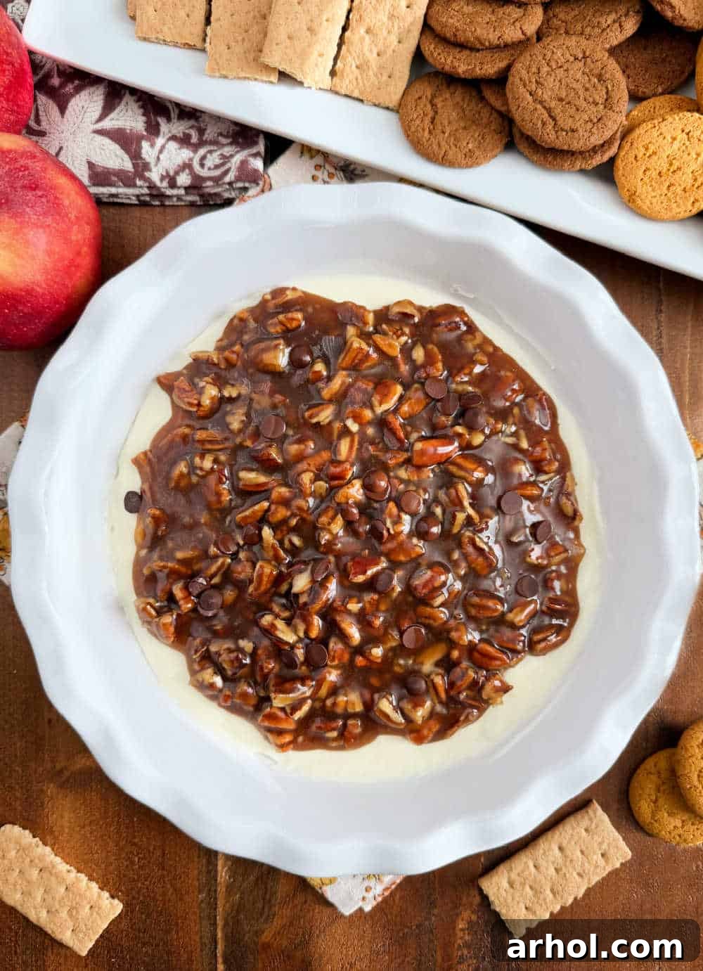pecan pie dessert dip in pie dish on table.