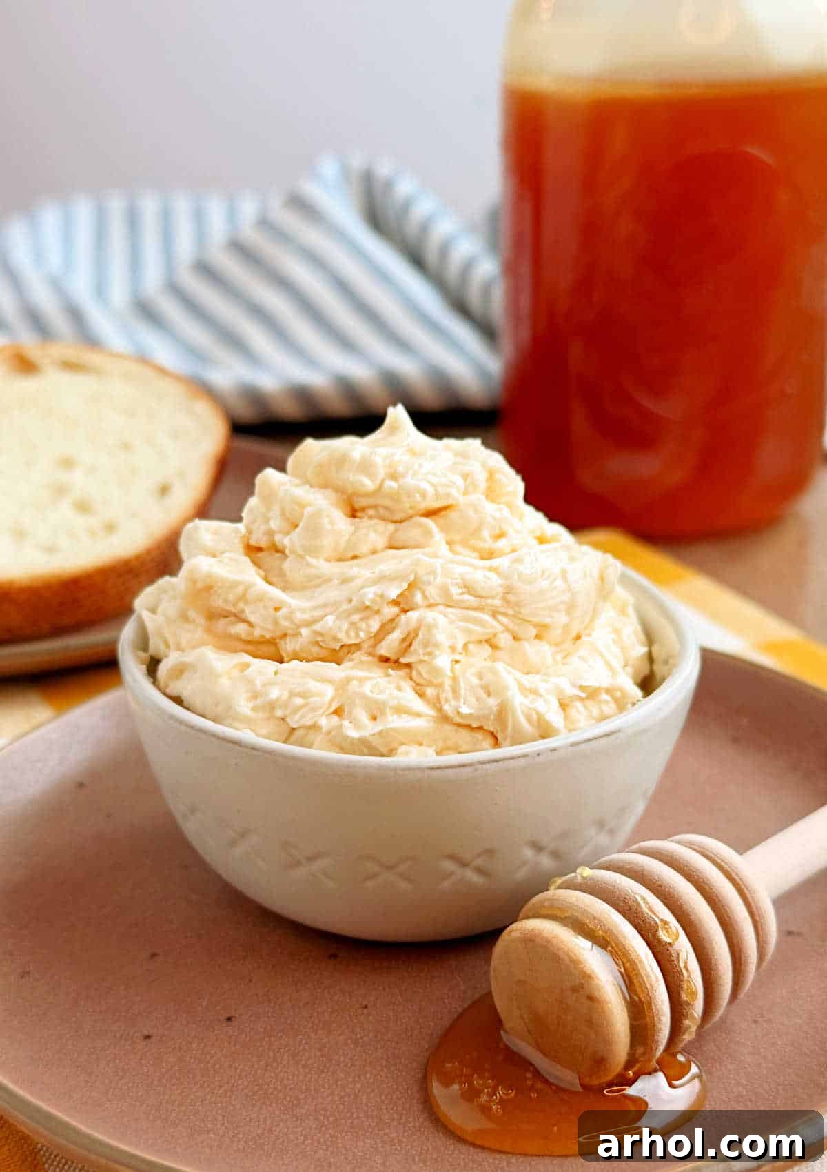 Effortless Two-Ingredient Honey Butter 2 homemade honey butter in bowl on the table.