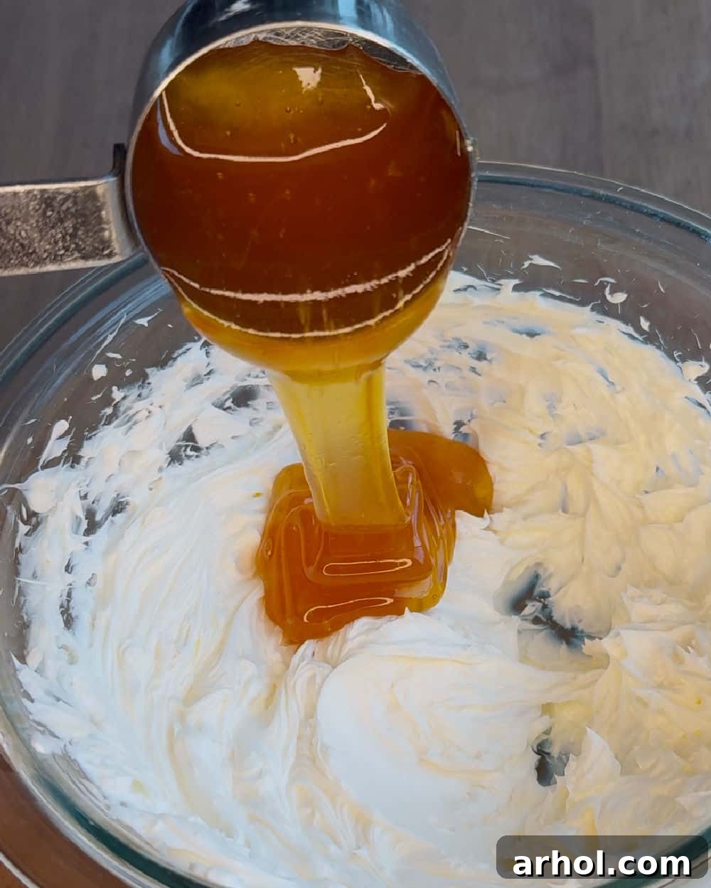Effortless Two-Ingredient Honey Butter 5 pour honey into bowl.
