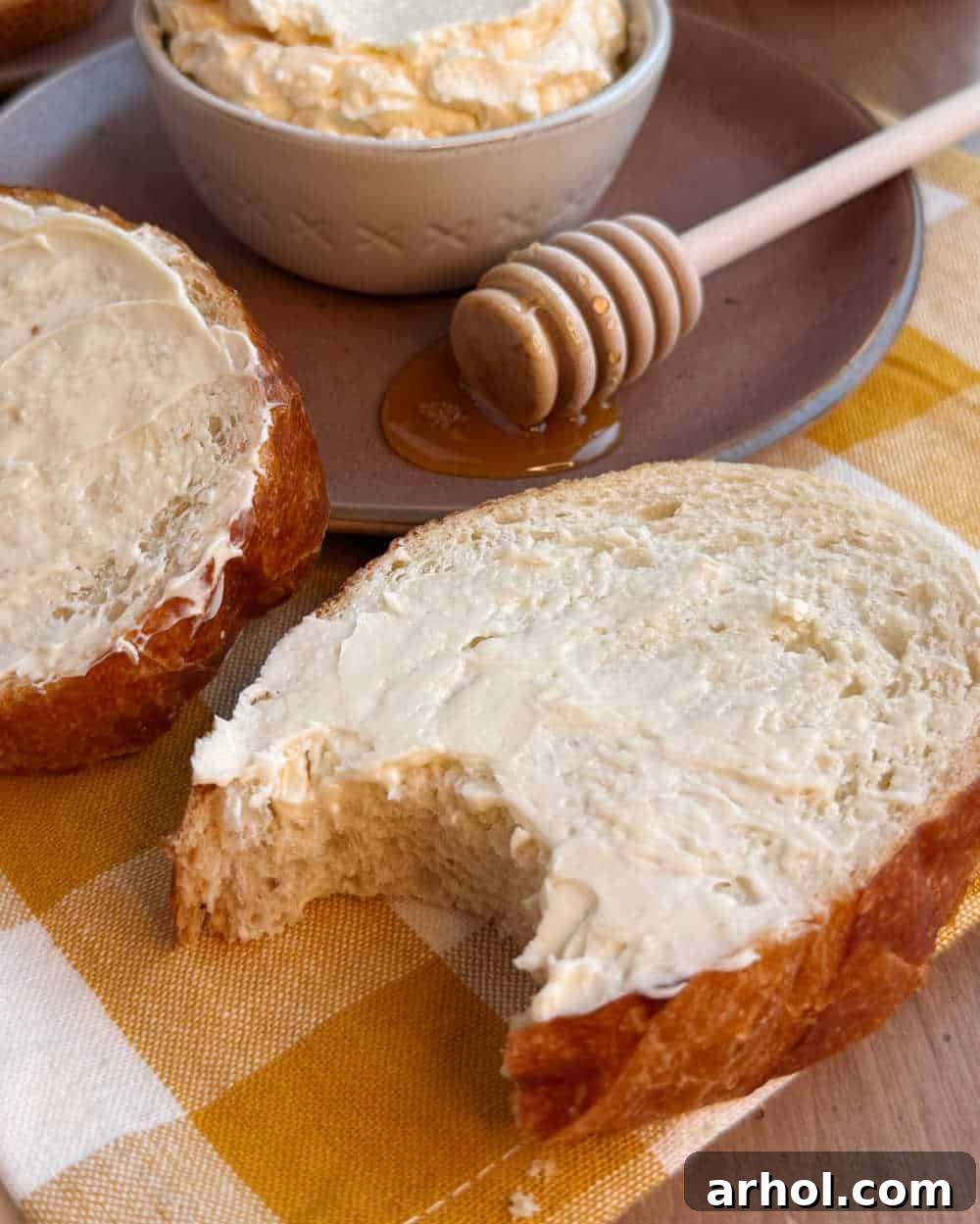 Effortless Two-Ingredient Honey Butter 7 buttered bread with bite mark.