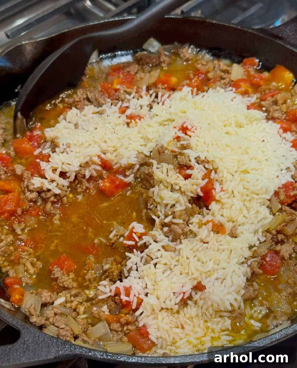Grandma's Signature Stuffed Peppers 4 cook filling in skillet.