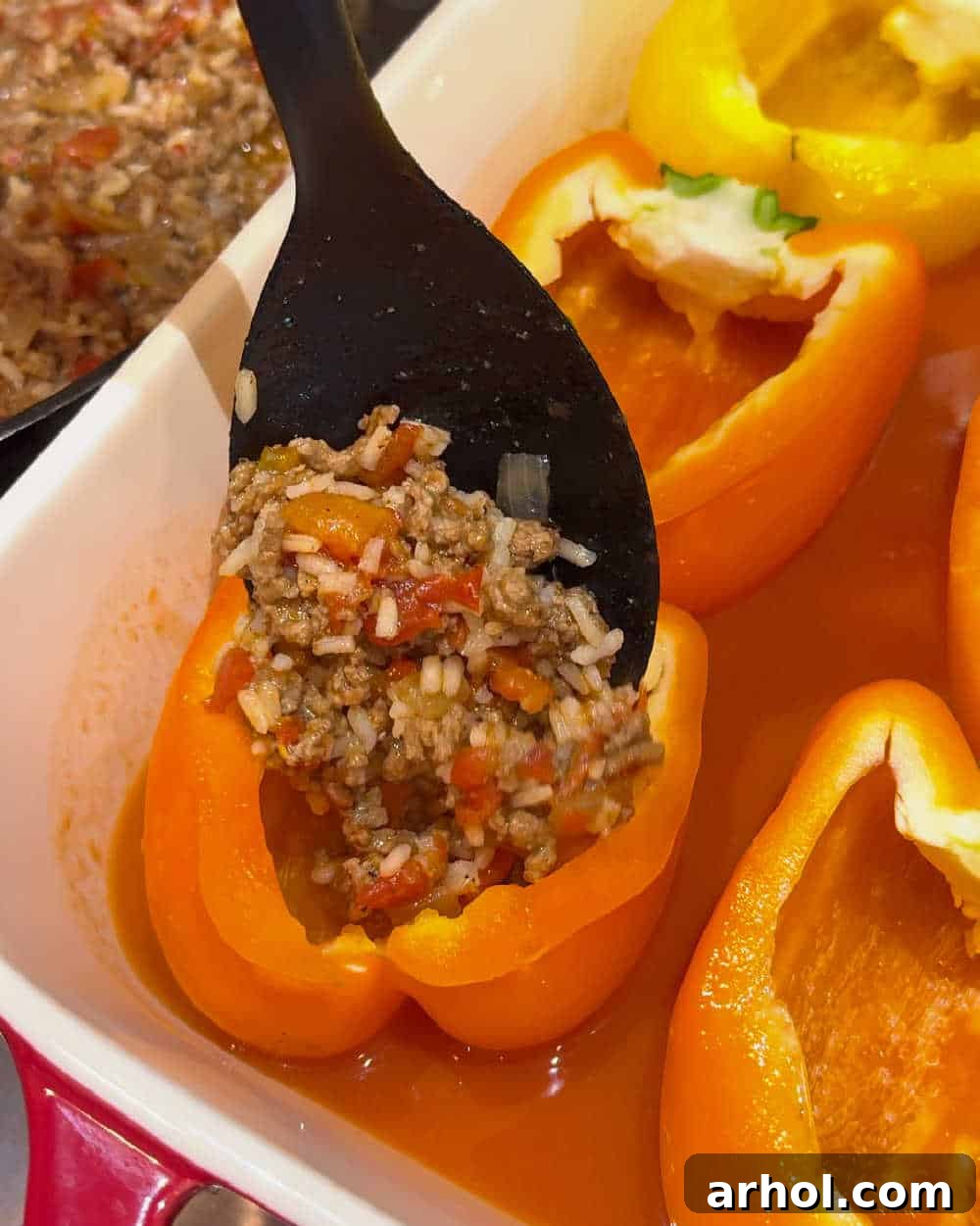 Grandma's Signature Stuffed Peppers 6 add filling to bell peppers.