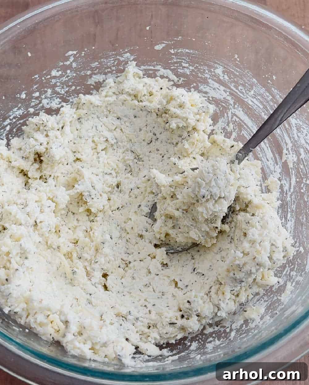 Creamy ricotta mixture with mozzarella, Parmesan, and seasonings, ready for stuffing.