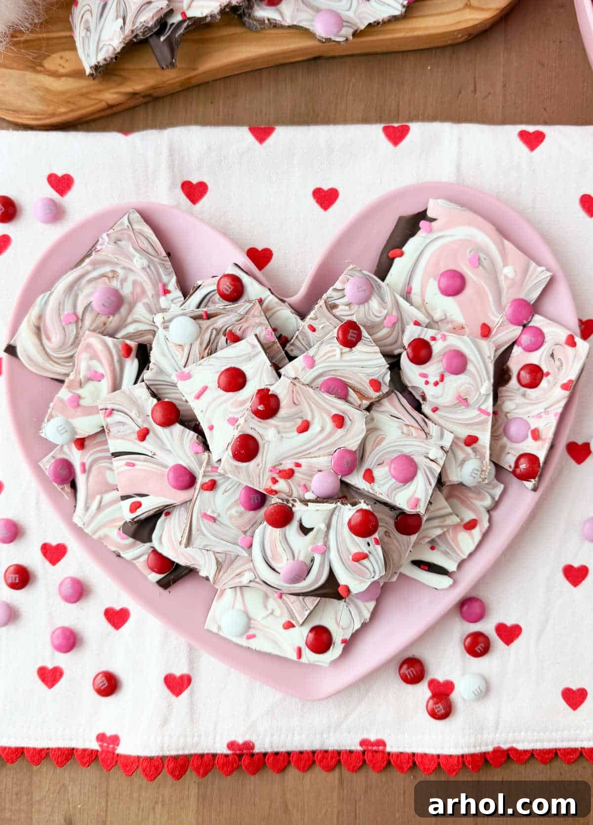 Pink and white Valentine's Day bark with M&M's, a perfect homemade sweet treat for showing love.