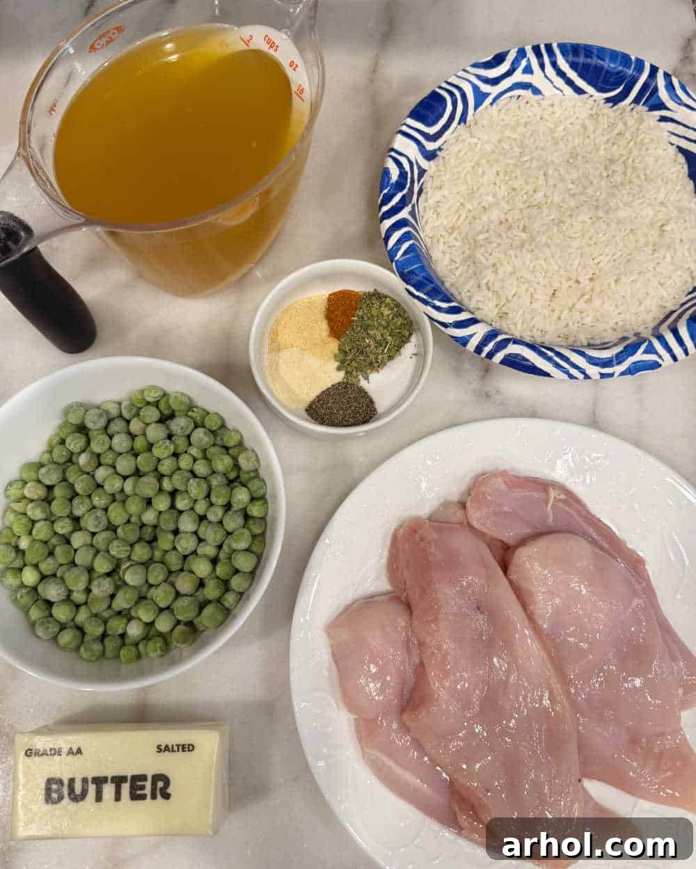 Ingredients for one-pan chicken and rice: chicken, instant rice, peas, broth, butter, and spices.