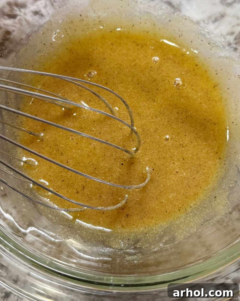 Golden Baked Honey Mustard Salmon 5 honey mustard sauce in bowl.