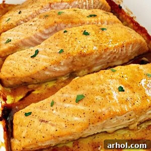 Golden Baked Honey Mustard Salmon 9 honey mustard salmon fillets in baking dish.