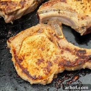Bone-in pork chops on blackstone griddle.