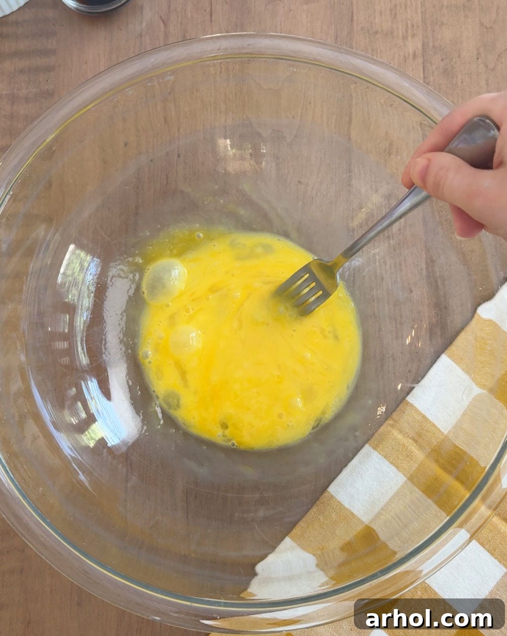 Whisked eggs in a large mixing bowl, ready for the meatloaf mixture.