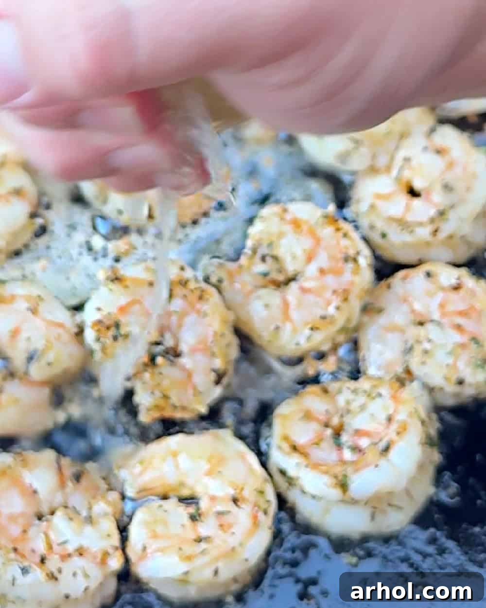 squeeze lemon juice on shrimp.