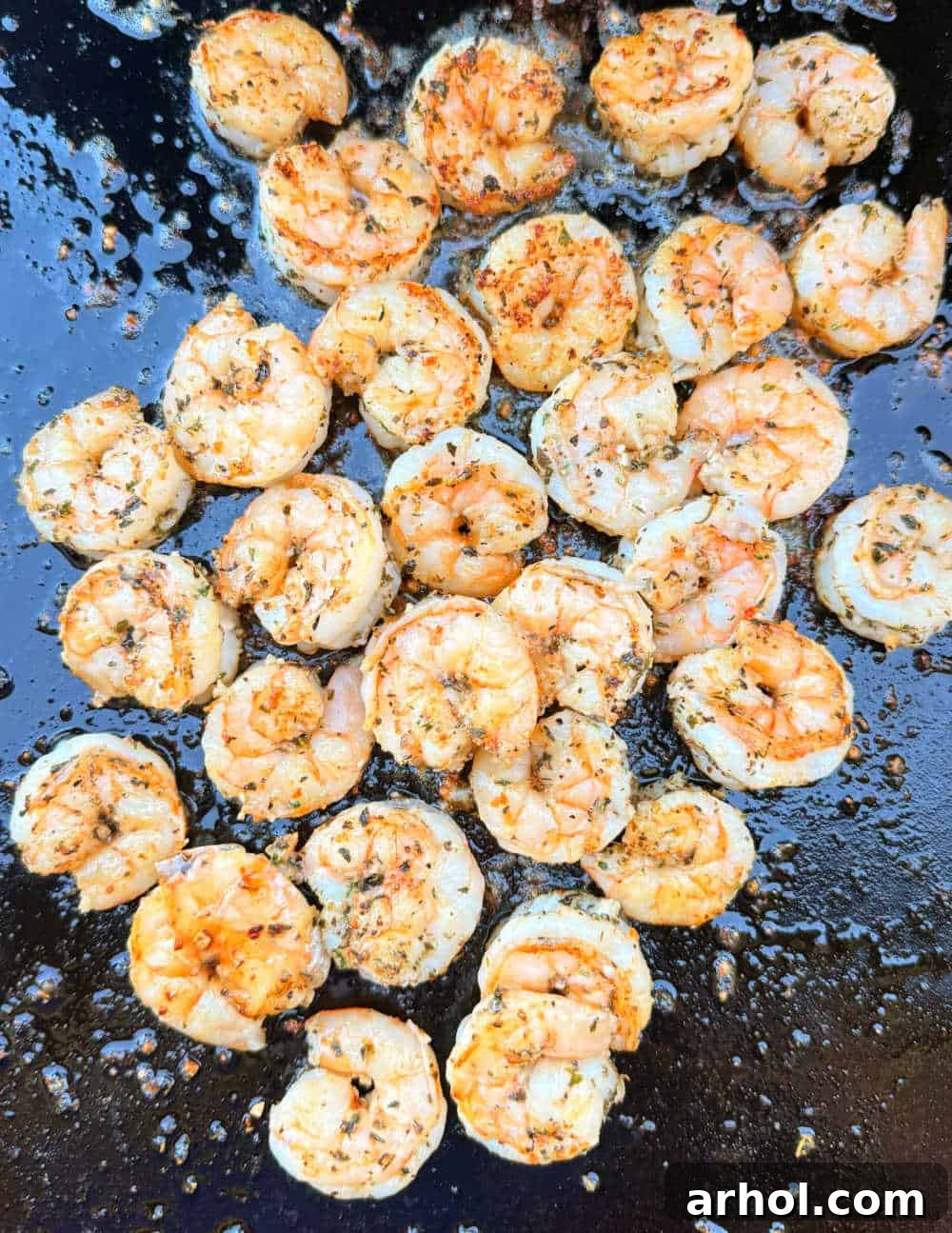 seared blackstone shrimp on griddle.