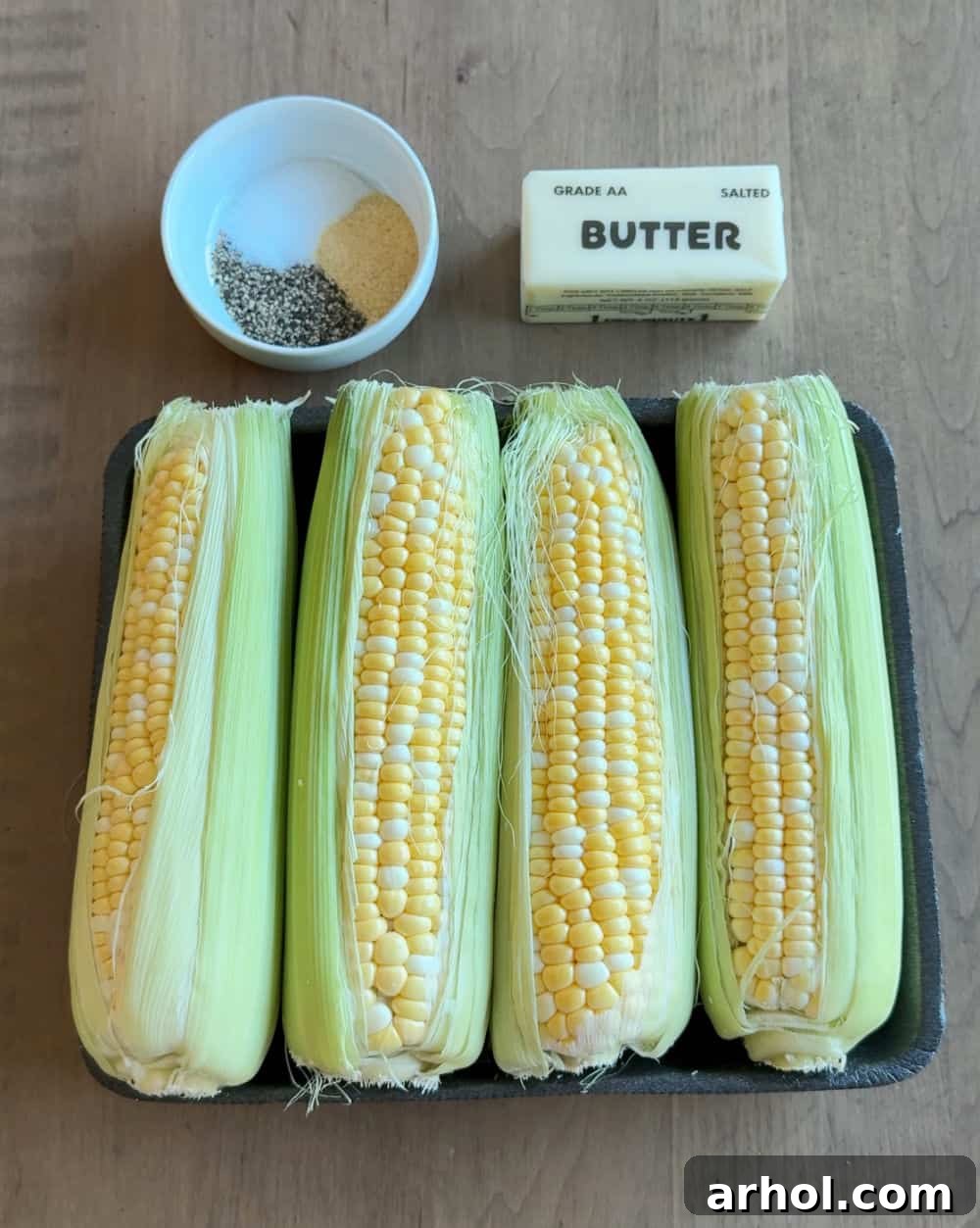 corn in husks, butter, seasonings.