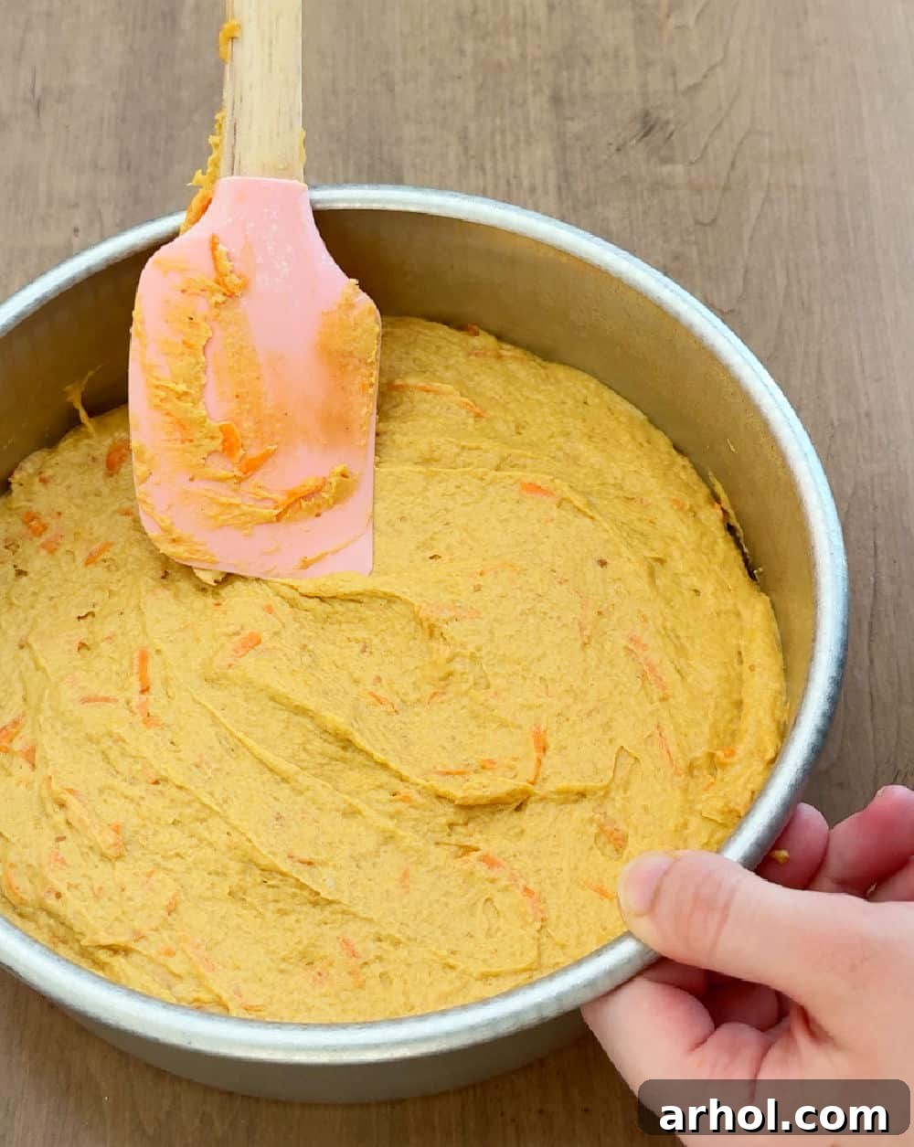 Wag-Worthy Homemade Dog Cake 5 Spreading dog cake batter evenly into a cake pan.