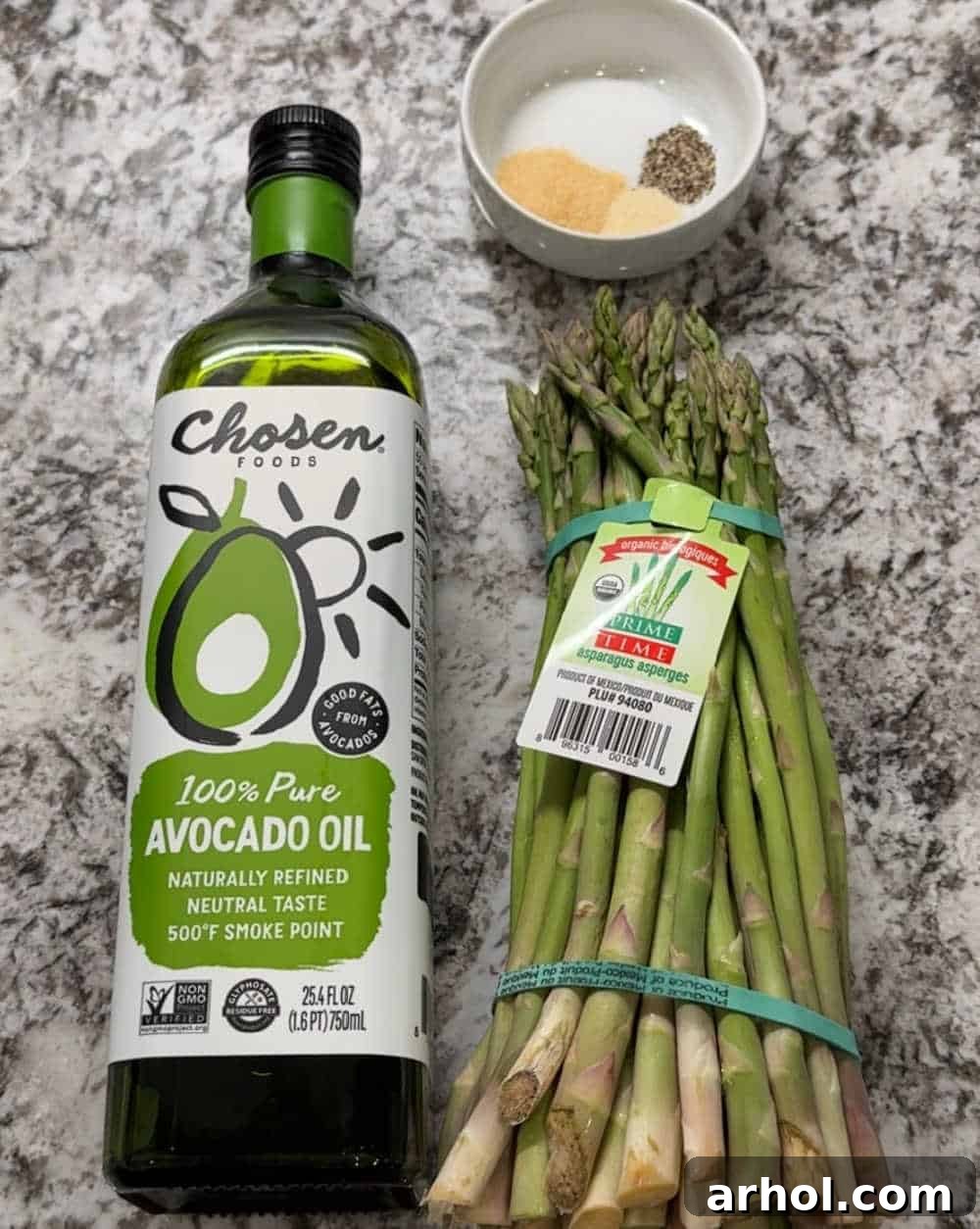 fresh bunch of asparagus, avocado oil and spices.