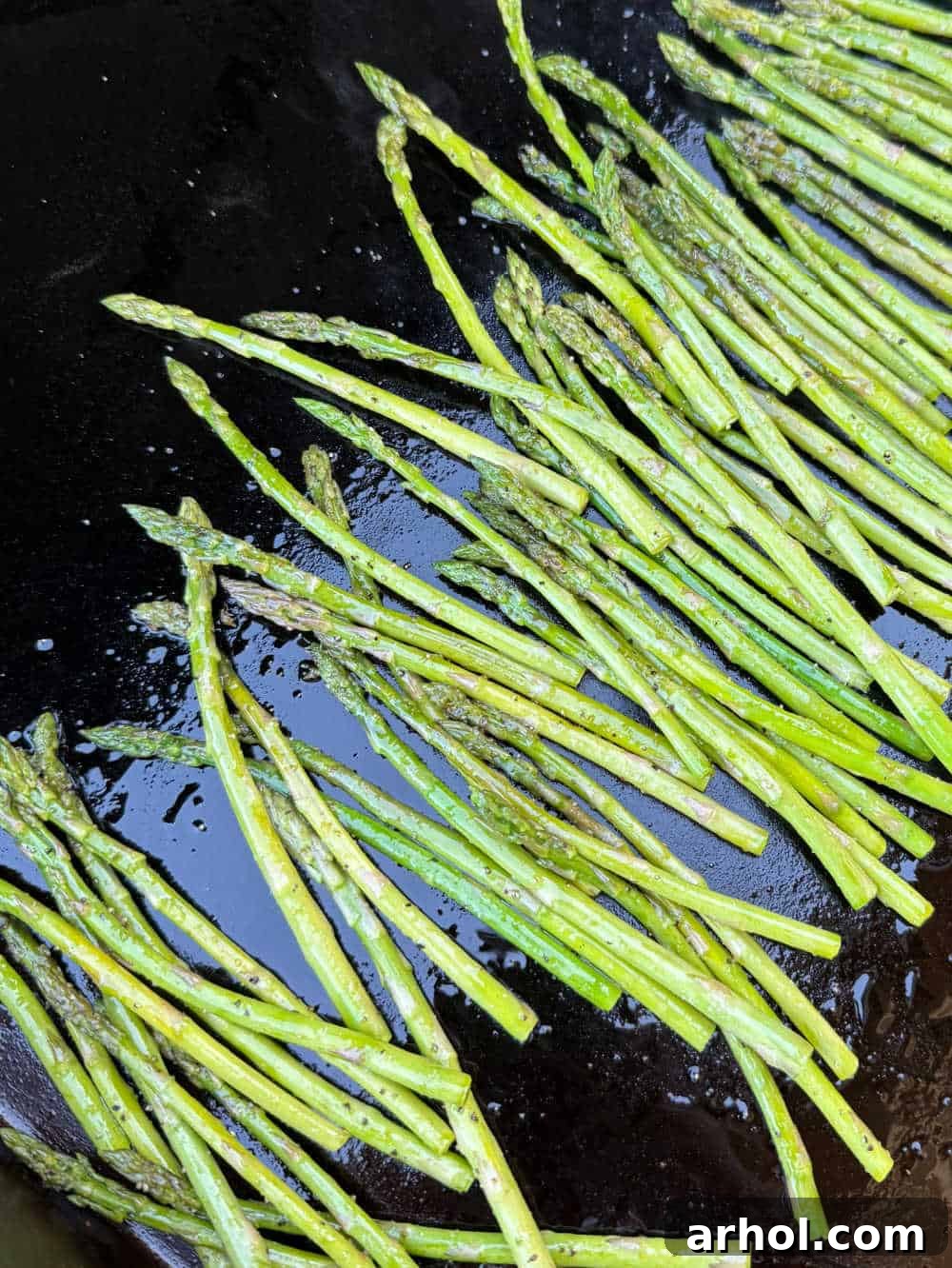 cooked asparagus on griddle.