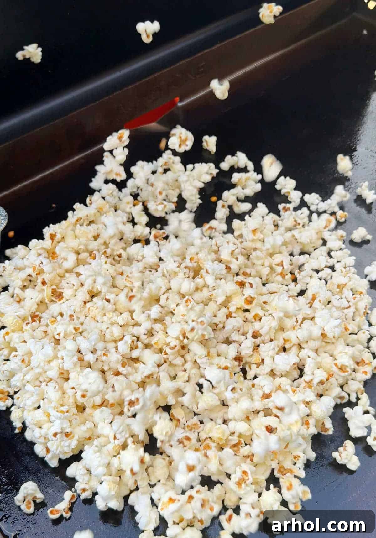 popcorn popping on griddle.