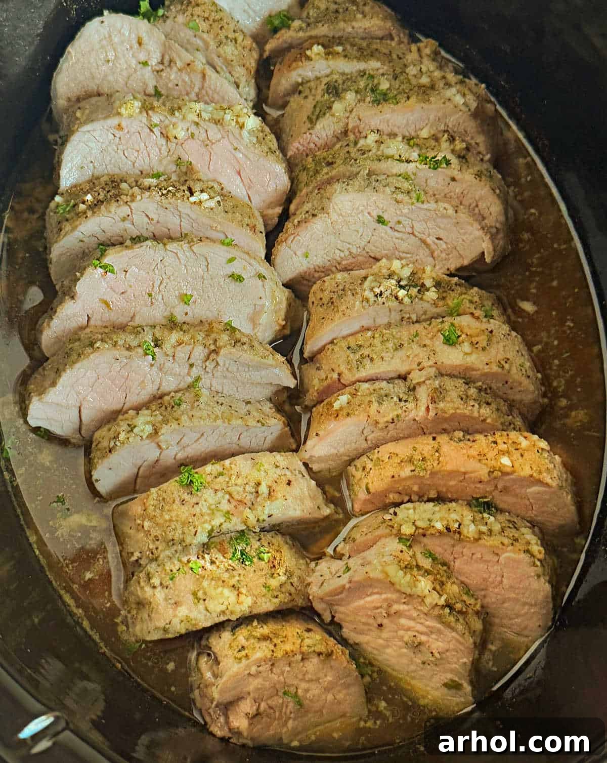 garlic butter crock pot pork tenderloin in slow cooker.