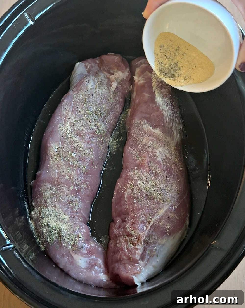 seasoning the meat.