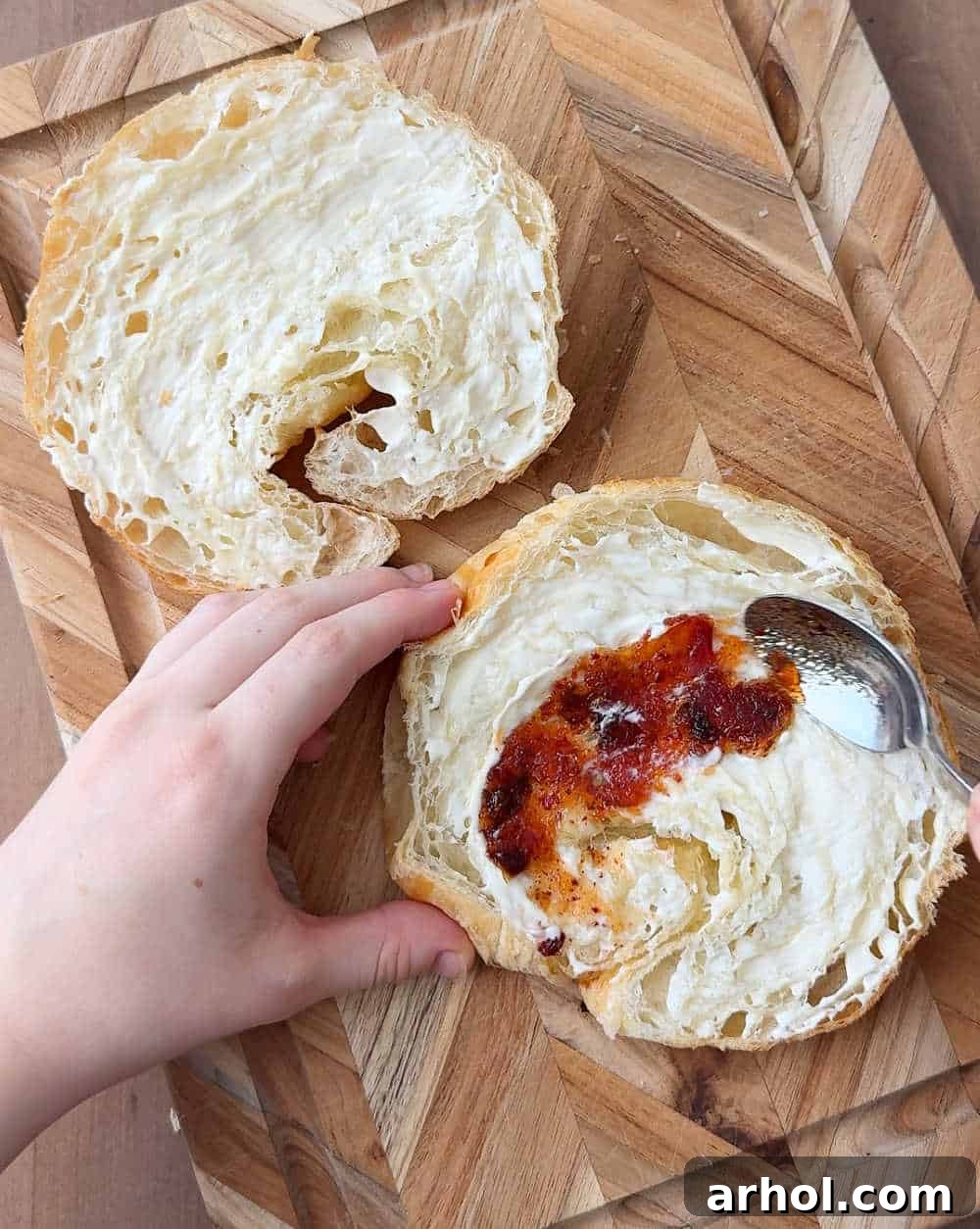 spreading mayo and jelly on bread.