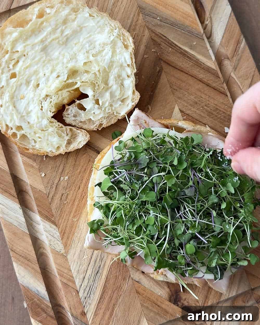 adding salt and micro greens.