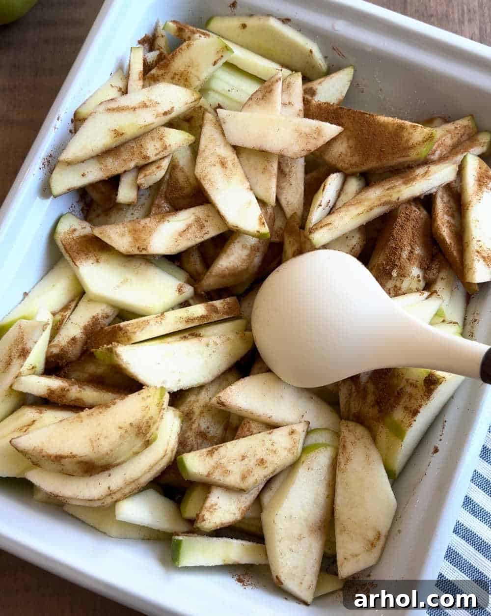 mix apple slices with cinnamon and sugar.