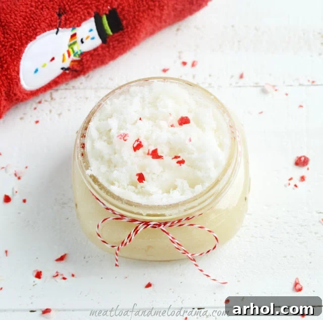 Festive homemade Peppermint Vanilla Sugar Scrubs in jars with ribbons, ready for gifting.