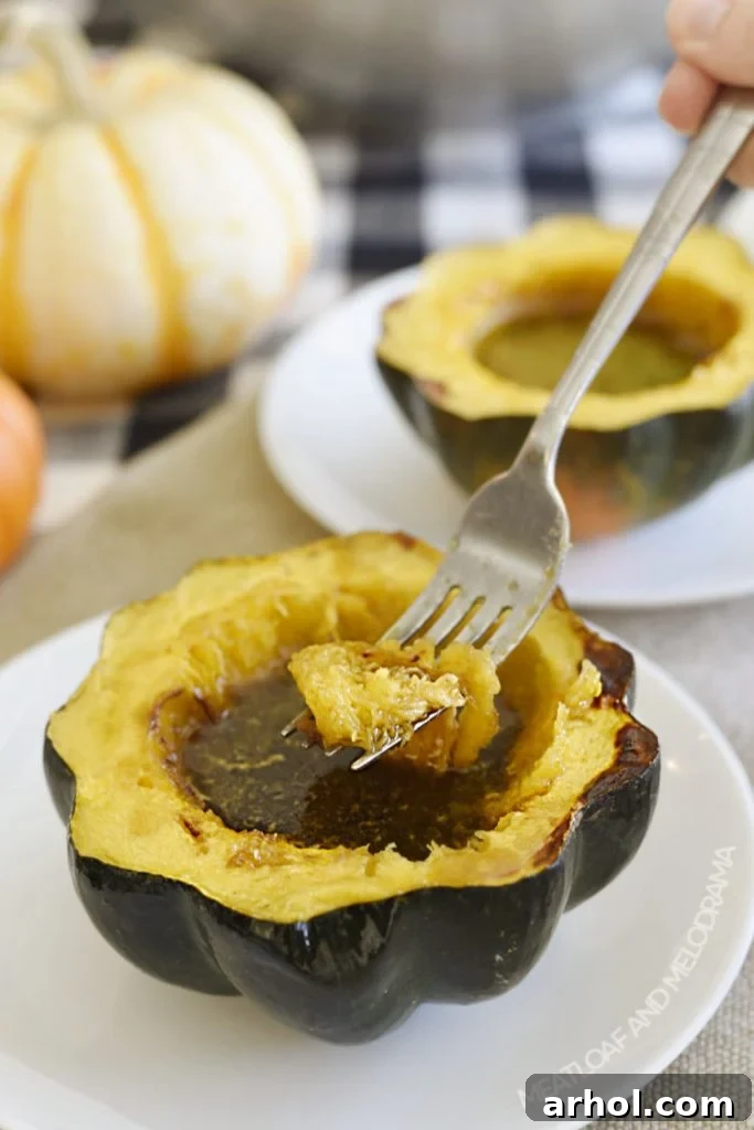 acorn squash with maple syrup and brown sugar on fork