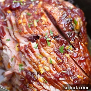 Christmas spiral cut ham with cranberry orange glaze in slow cooker