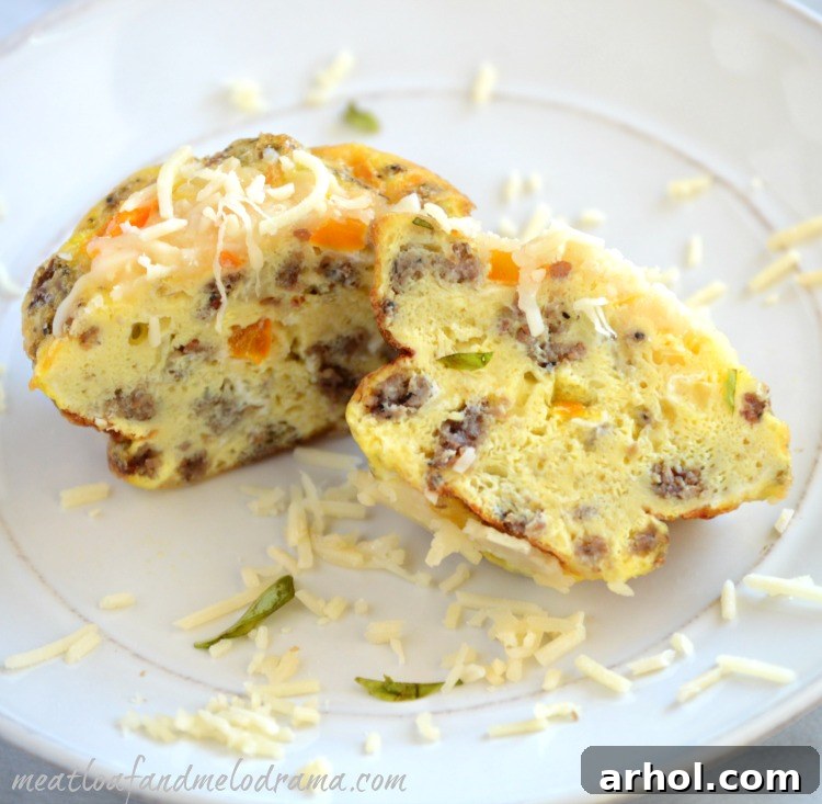Golden Cheesy Sausage Egg Muffins 3 Plated Savory Sausage and Egg Muffin Cups with fresh basil garnish