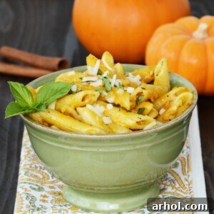 Easy Pumpkin Alfredo Pasta dish with fork